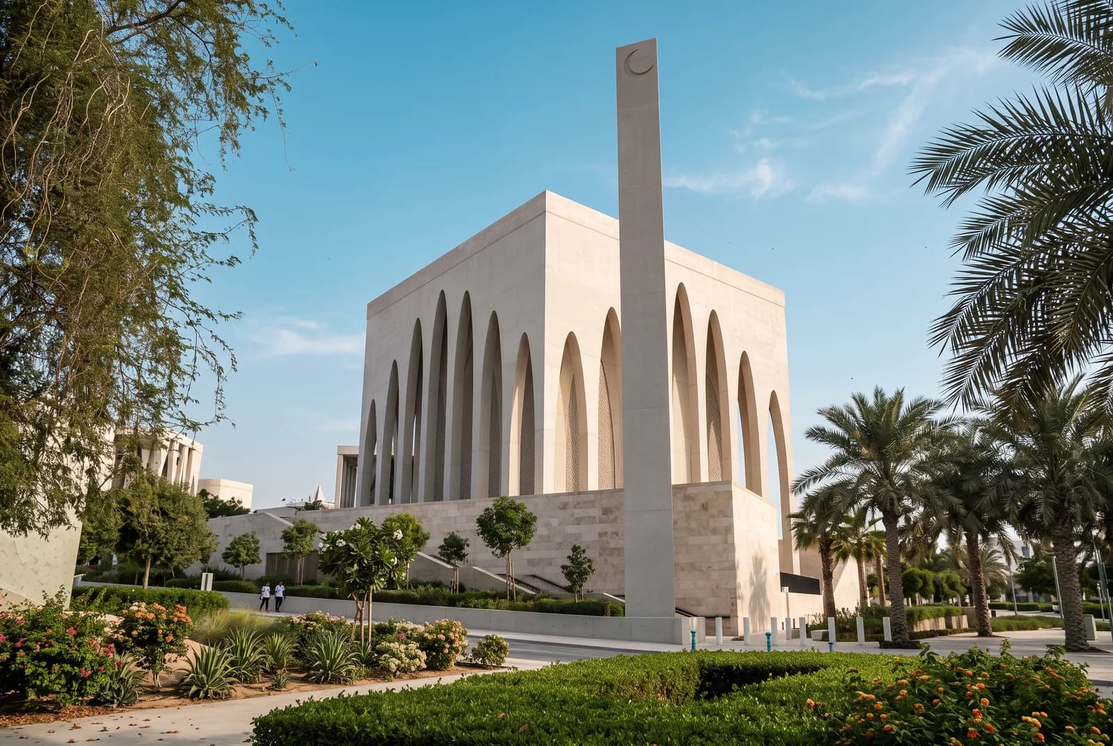 The mosque and its minaret above the garden